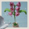 Imagen de 1 Flor con maseta tejida.